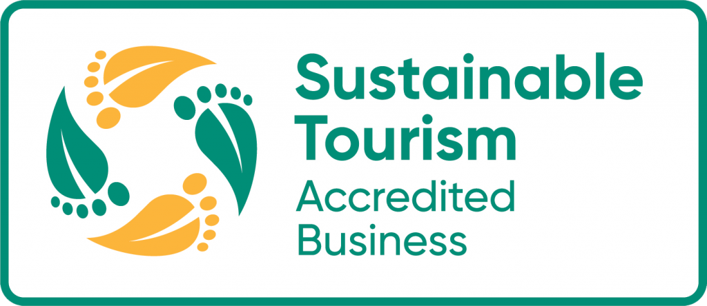 A logo showing that Tree Chalets is a Sustainable Tourism Accredited business